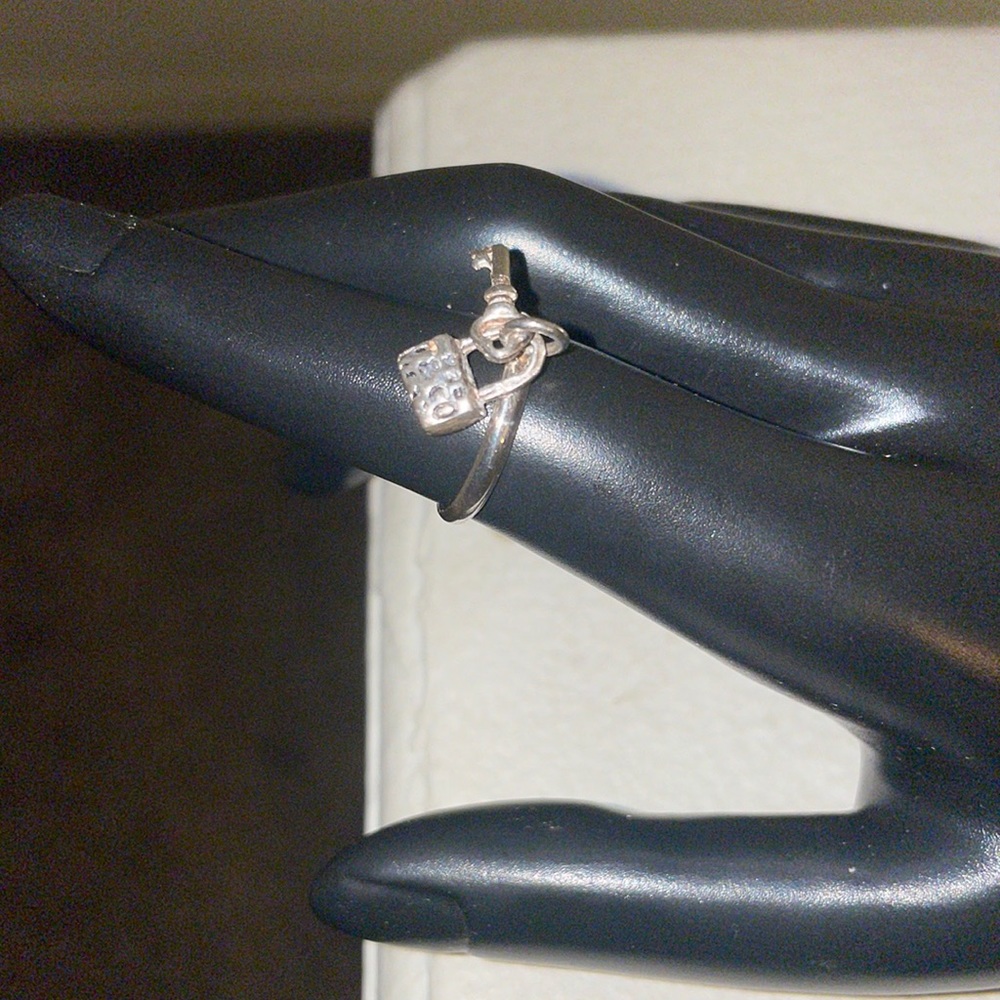 Dangle ring with suit case and lock